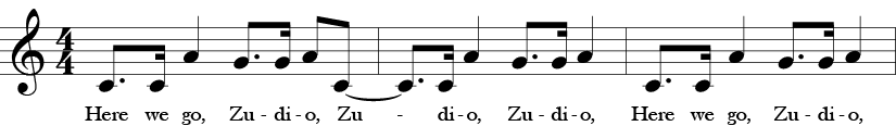 First three measure of "Here We Go, Zudio" Treble clef 4/4 time signature. Dotted eighth C, 16th C, A quarter note, dotted eight G, 16th G, eighth A, eigth C, tied to dotted eigth C, 16th C, quarter note A, dotted eigth G, sixteeth note G, quarter note A, dotted eigth C, 16th C, quarter note A, dotted eigth G, sixteenth G, quarter note A. Words are Here we go, Zudio, Zudio, Zudio, Here we go Zudio.