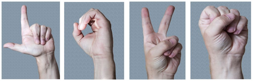 photograph of the letters L, O, V, and E in sign language.