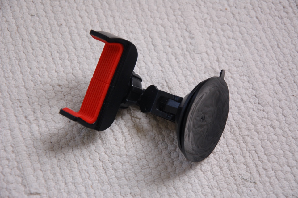 Phone holder with a diaphragm base.