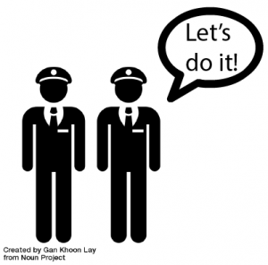 Two policemen with the text "Let's do it!" in a bubble above their head.
