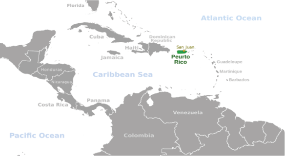 A greyed-out map of the Caribbean, with Puerto Rico highlighted in green.