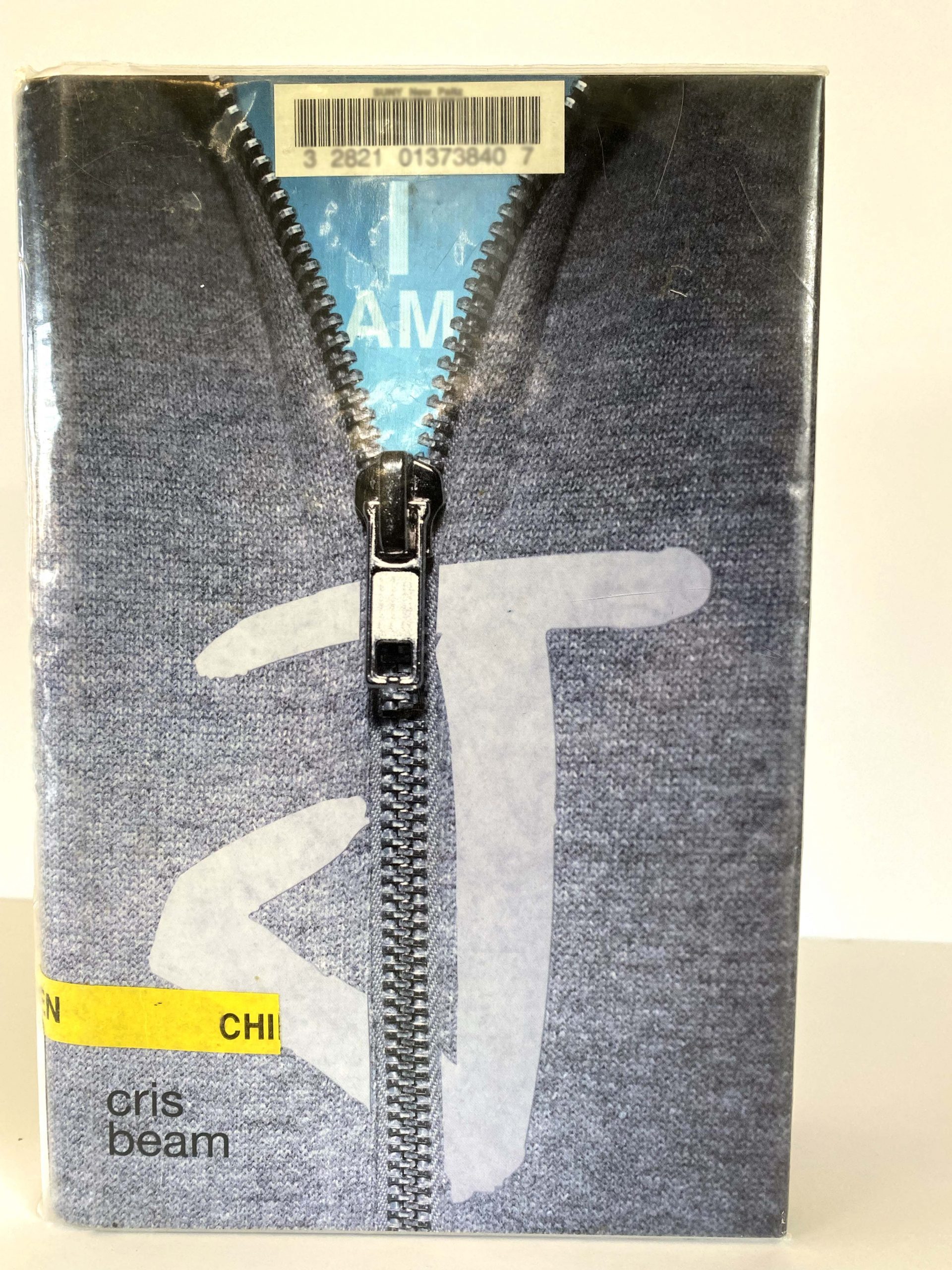 A book with a zipper on its cover.