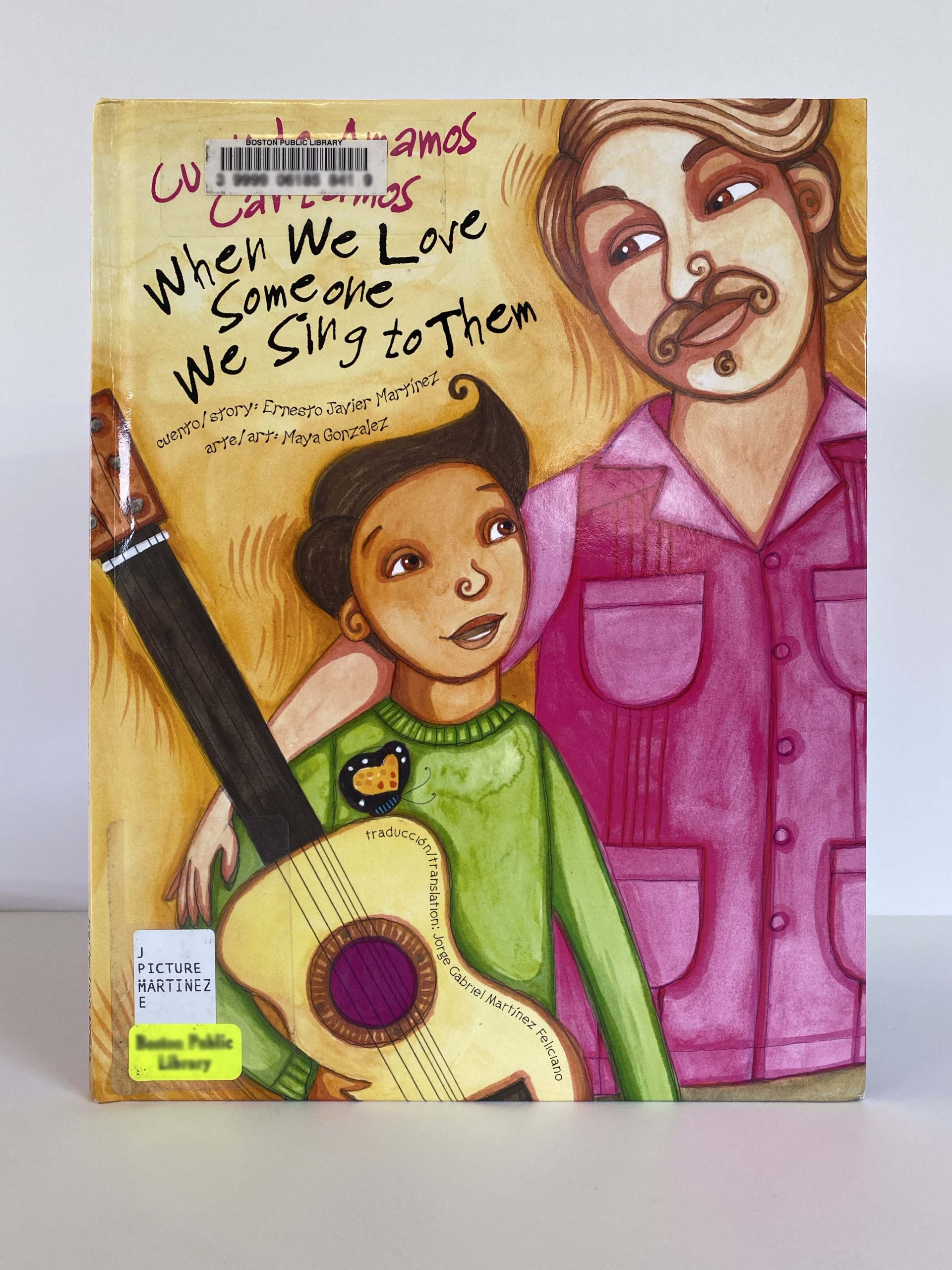 A book with the illustration of a child holding a guitar.