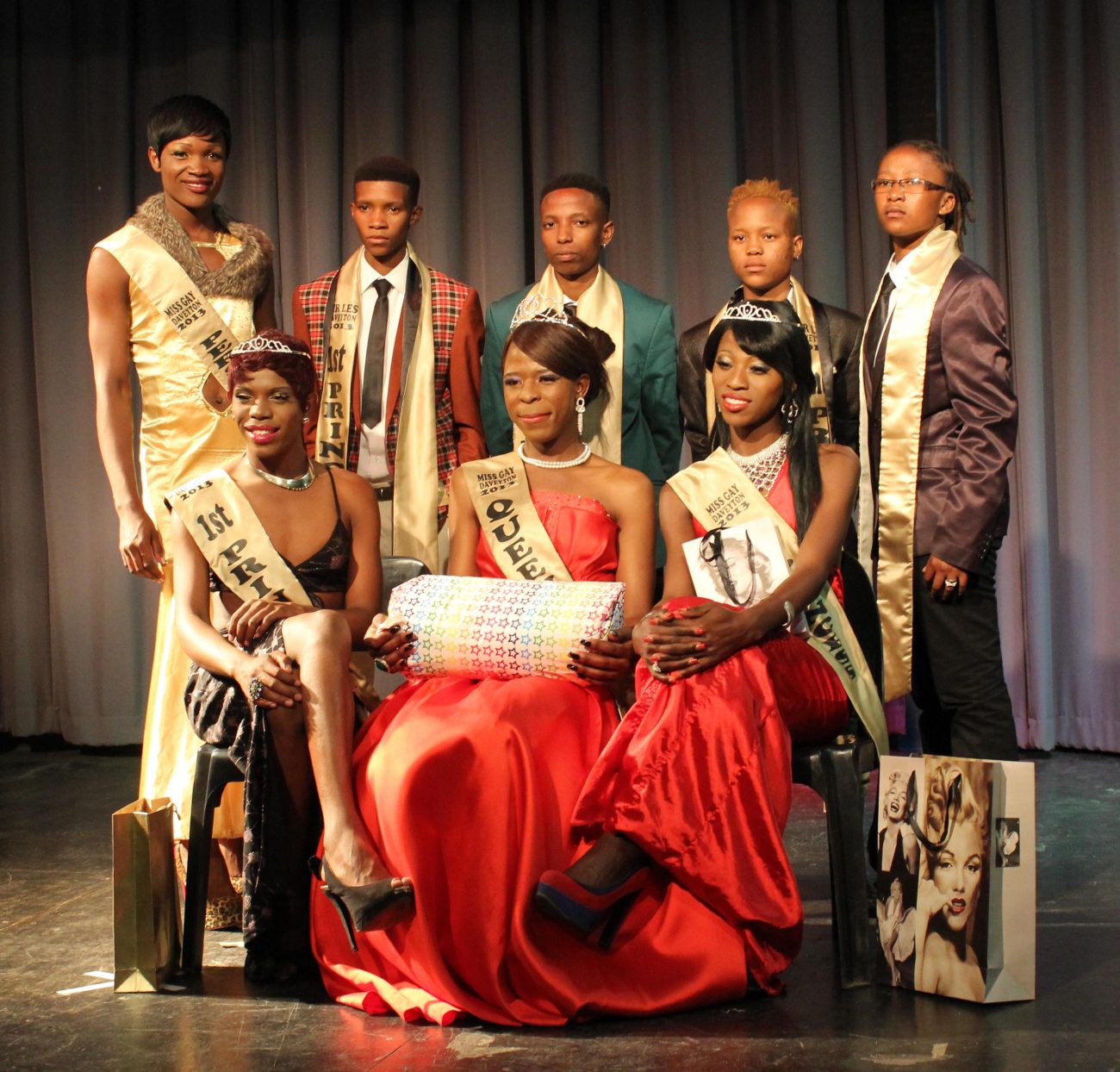 Image of African people in professional attire with sashes.