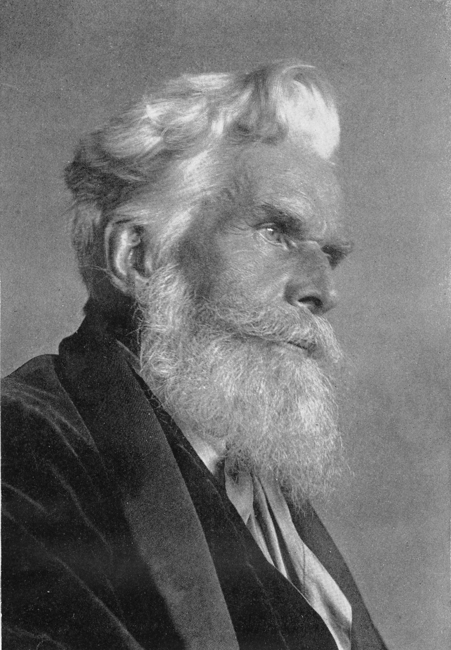 Old photograph of a man in a suit with a long beard.