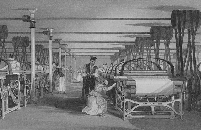 An illustration of an old textile factory. A wide view shows workers operating large looms. A man supervises, while many women tend machines.