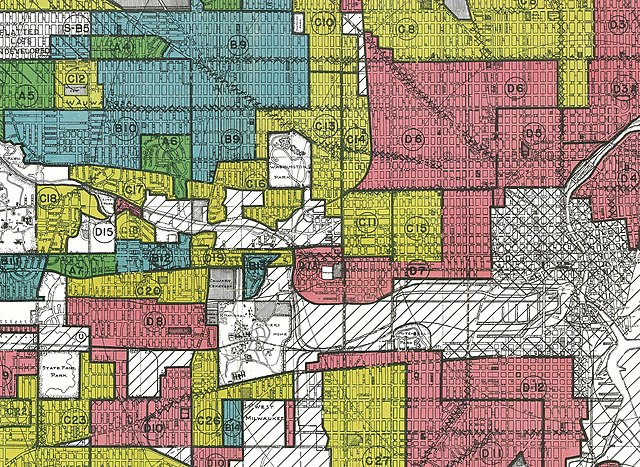 A colorful historical map with patchwork sections in red, green, blue, and yellow, marked with letters and numbers, detailing urban zoning or districts.