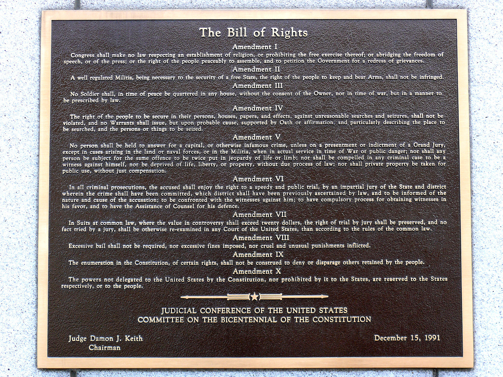Bronze plaque displaying the text of the Bill of Rights, amendments I to X. The plaque is mounted on a textured stone, dated December 15, 1991.